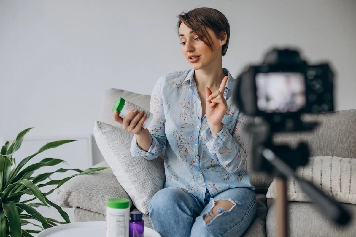 young woman blogger recording with a video camera